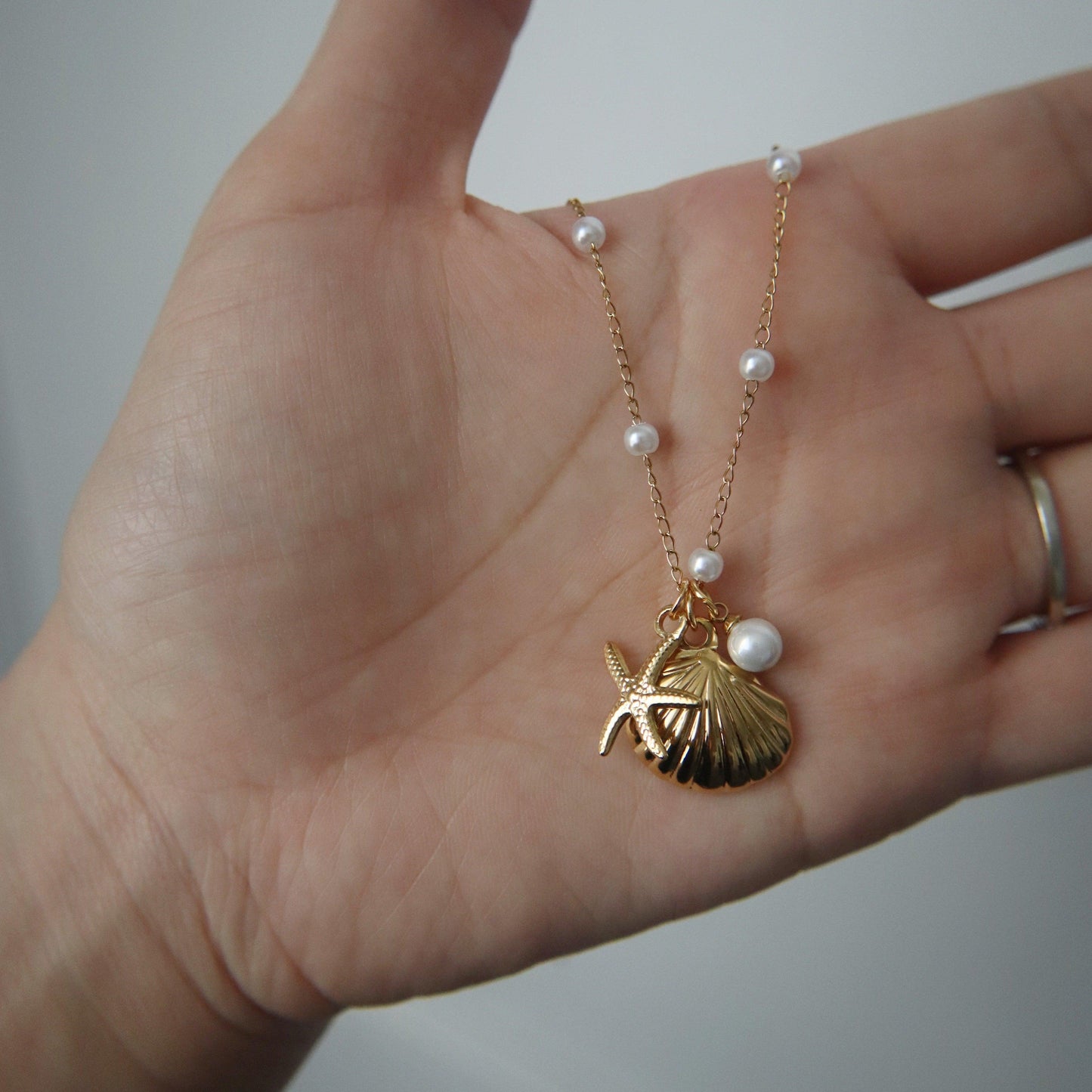 By the Shore Necklace | Shell and Star Pendant - JESSA JEWELRY | GOLD JEWELRY; dainty, affordable gold everyday jewelry. Tarnish free, water-resistant, hypoallergenic. Jewelry for everyday wear