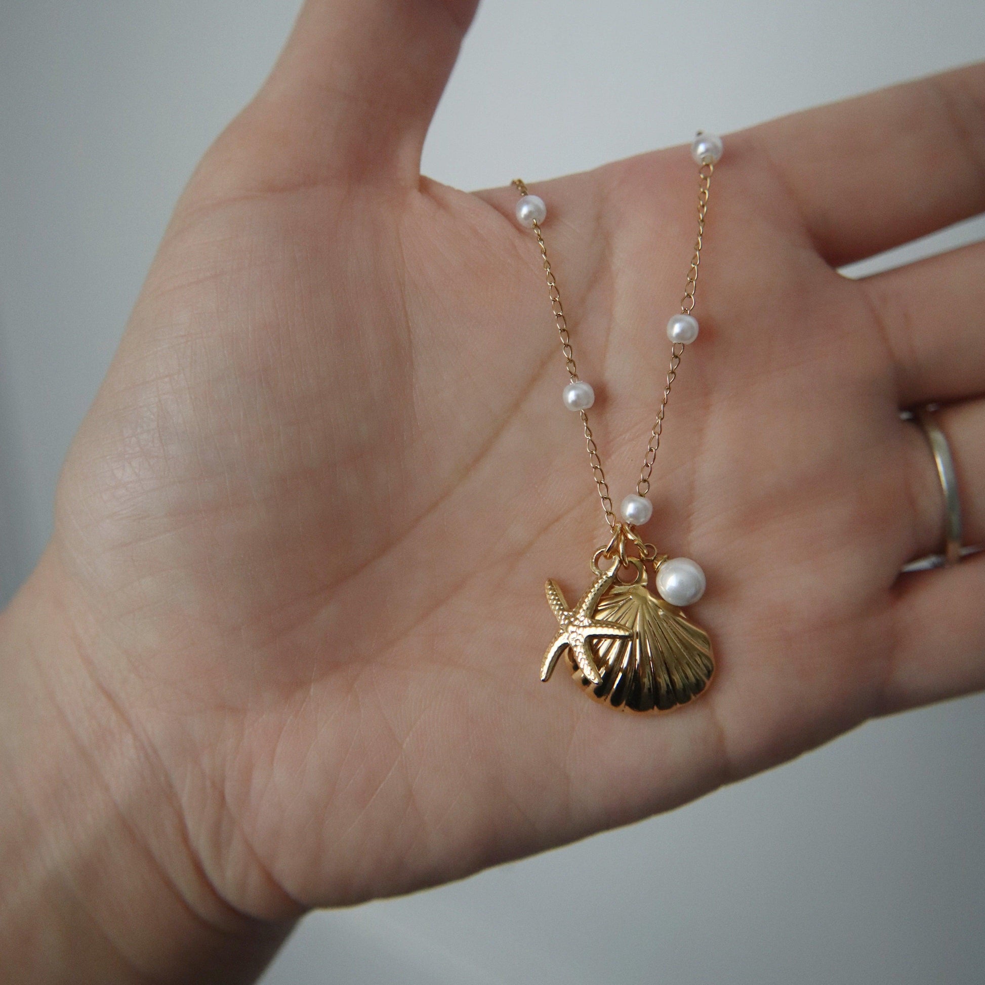 By the Shore Necklace | Shell and Star Pendant - JESSA JEWELRY | GOLD JEWELRY; dainty, affordable gold everyday jewelry. Tarnish free, water-resistant, hypoallergenic. Jewelry for everyday wear