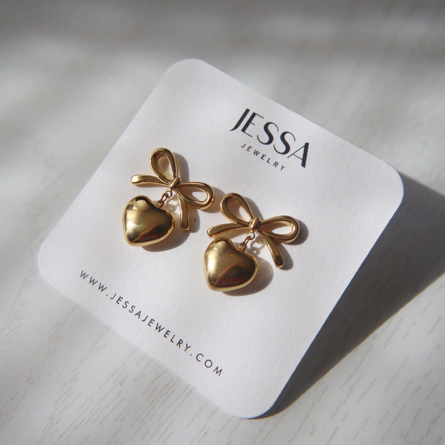 Bow Heart Earrings | Dangle Earrings - JESSA JEWELRY | GOLD JEWELRY; dainty, affordable gold everyday jewelry. Tarnish free, water-resistant, hypoallergenic. Jewelry for everyday wear