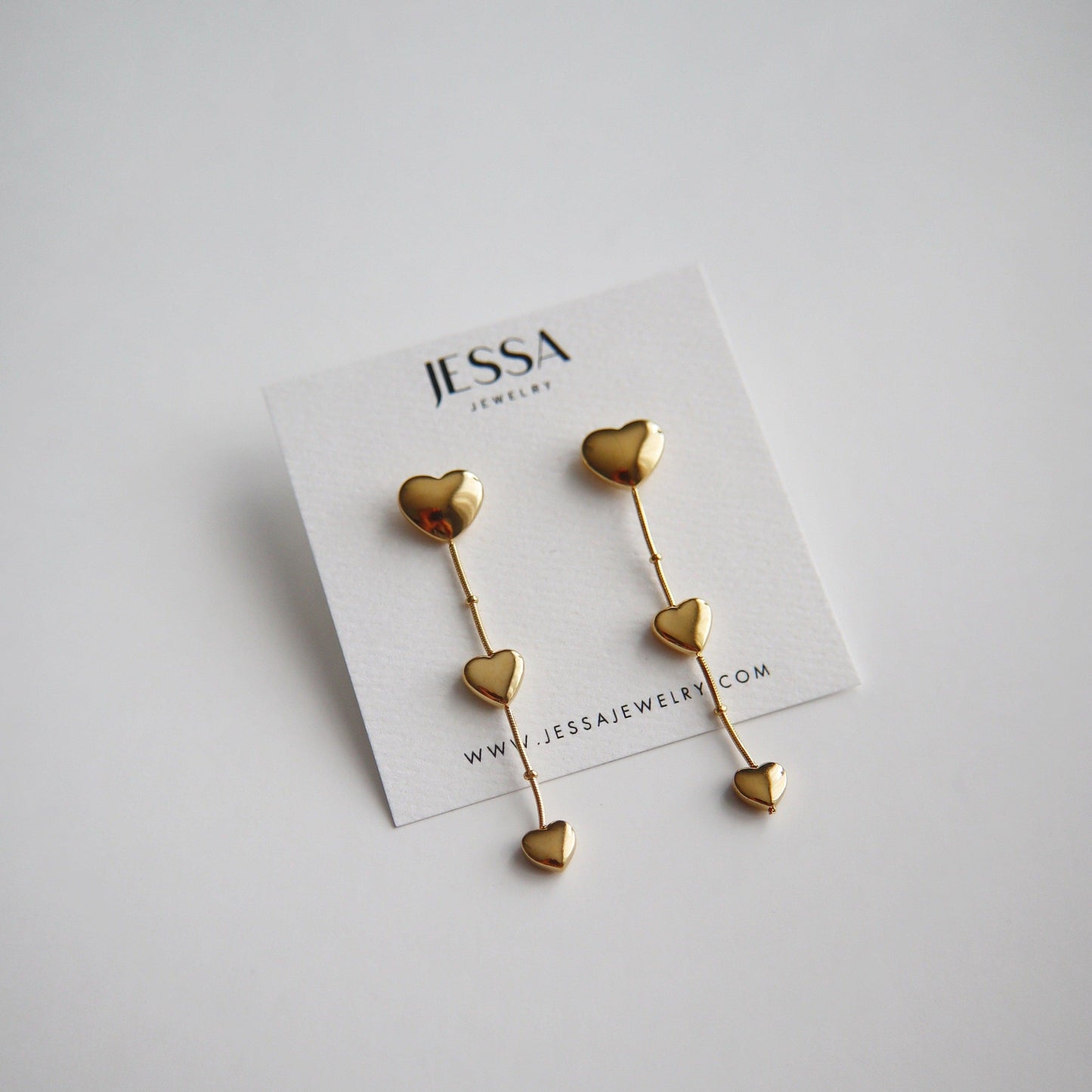 Triple Heart Dangle Earrings - JESSA JEWELRY | GOLD JEWELRY; dainty, affordable gold everyday jewelry. Tarnish free, water-resistant, hypoallergenic. Jewelry for everyday wear