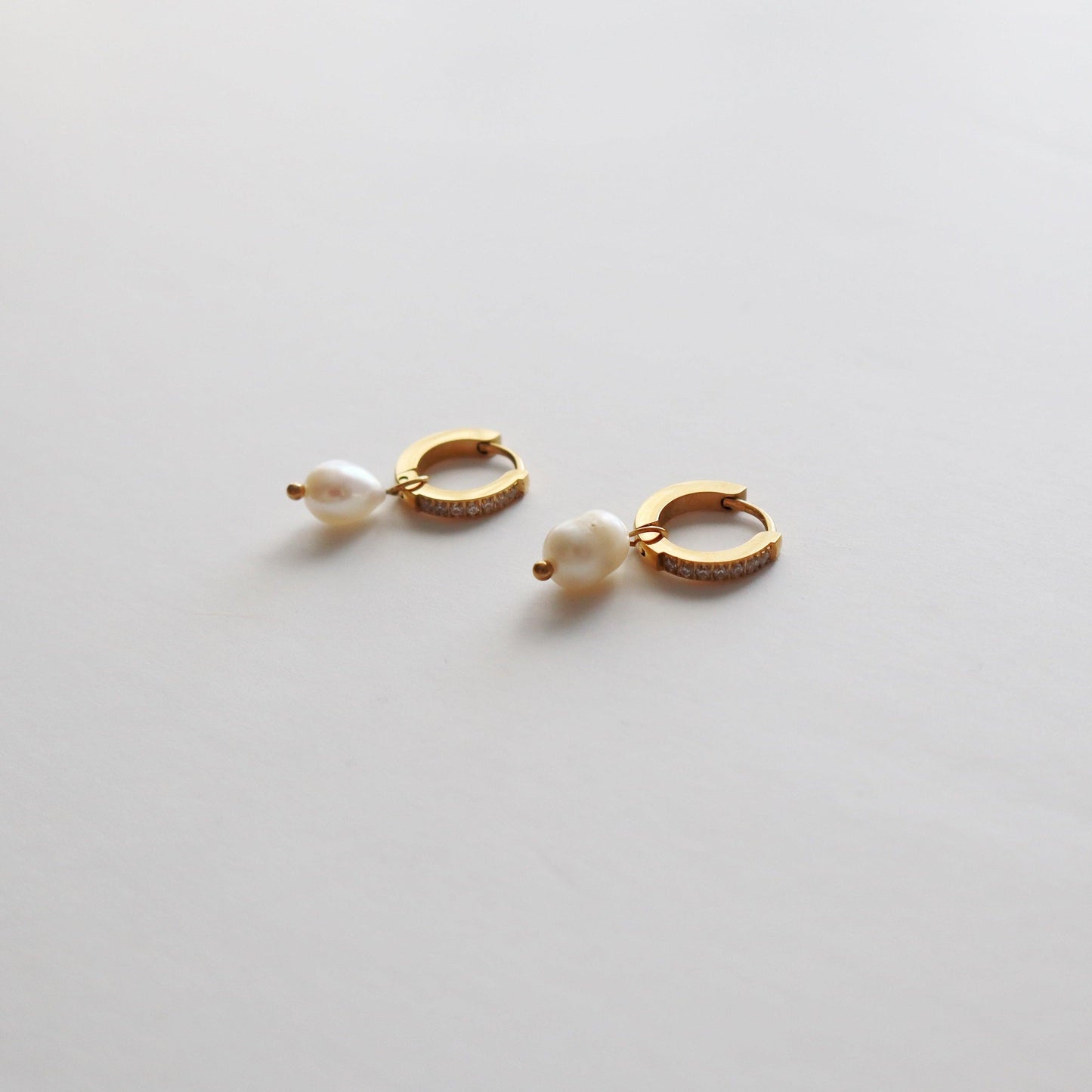 CZ Huggies with Pearl Drop - JESSA JEWELRY | GOLD JEWELRY; dainty, affordable gold everyday jewelry. Tarnish free, water-resistant, hypoallergenic. Jewelry for everyday wear