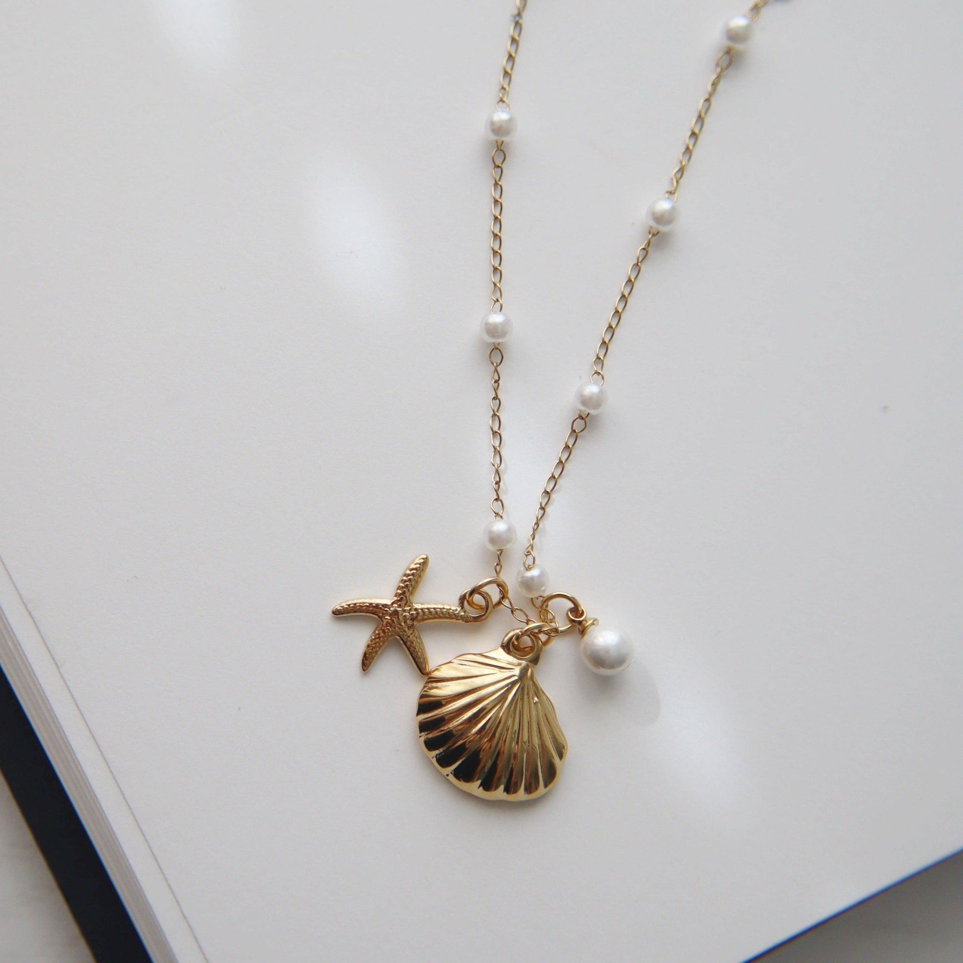 By the Shore Necklace | Shell and Star Pendant - JESSA JEWELRY | GOLD JEWELRY; dainty, affordable gold everyday jewelry. Tarnish free, water-resistant, hypoallergenic. Jewelry for everyday wear